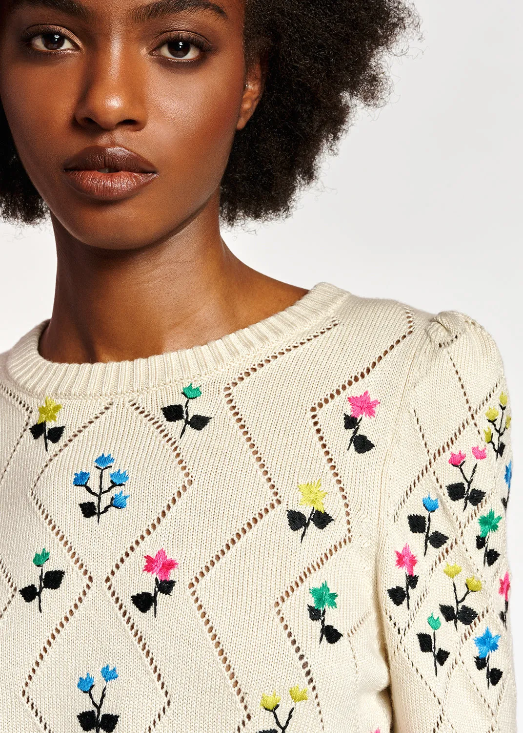 Beige pointelle-knitted sweater with floral embroideries
