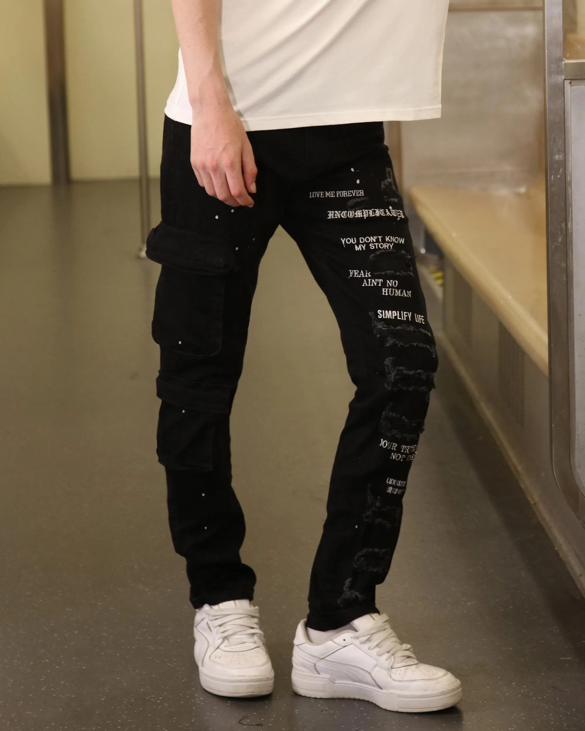 Straight Leg Black Ripped Jeans with Spray Paint Detailing