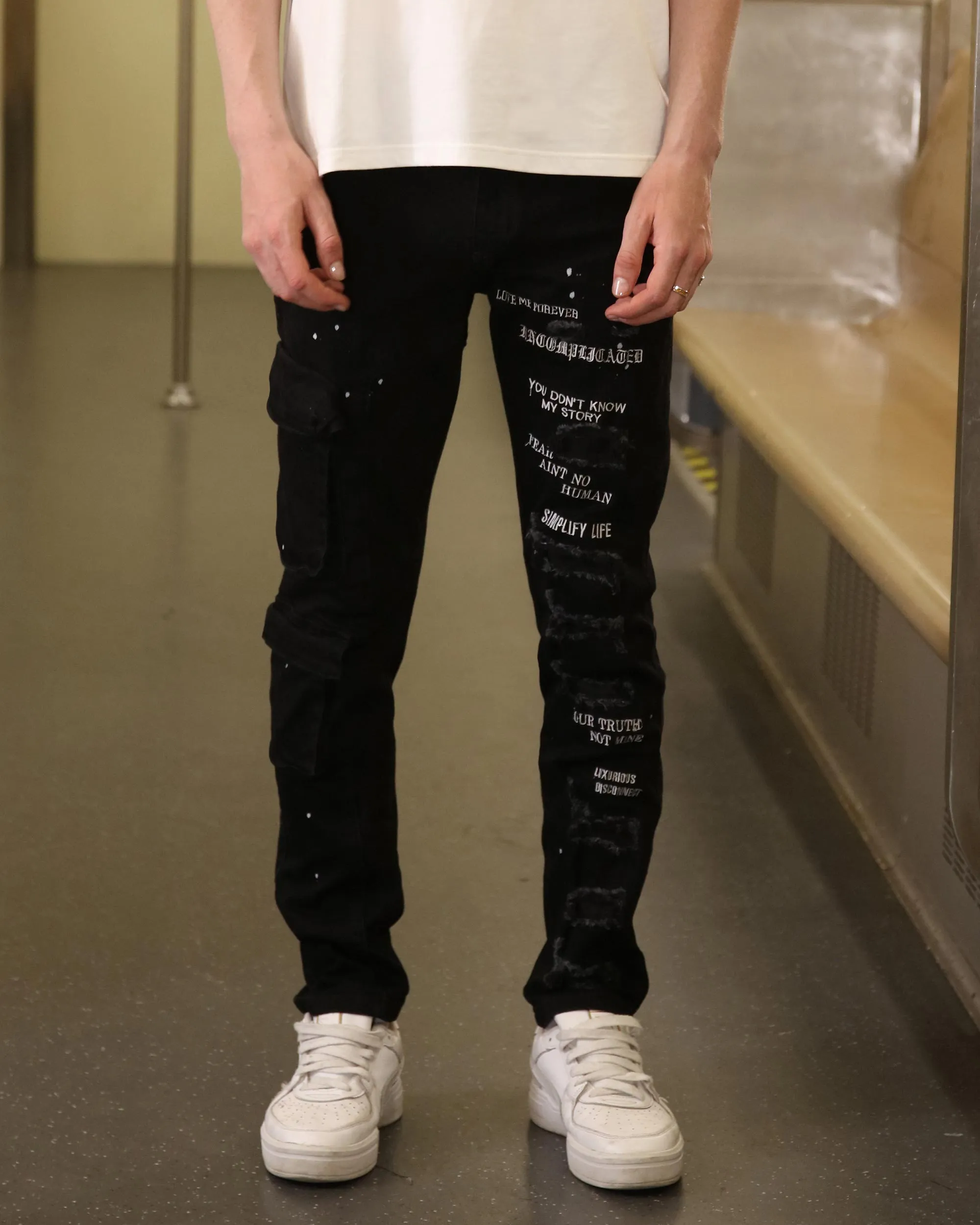 Straight Leg Black Ripped Jeans with Spray Paint Detailing