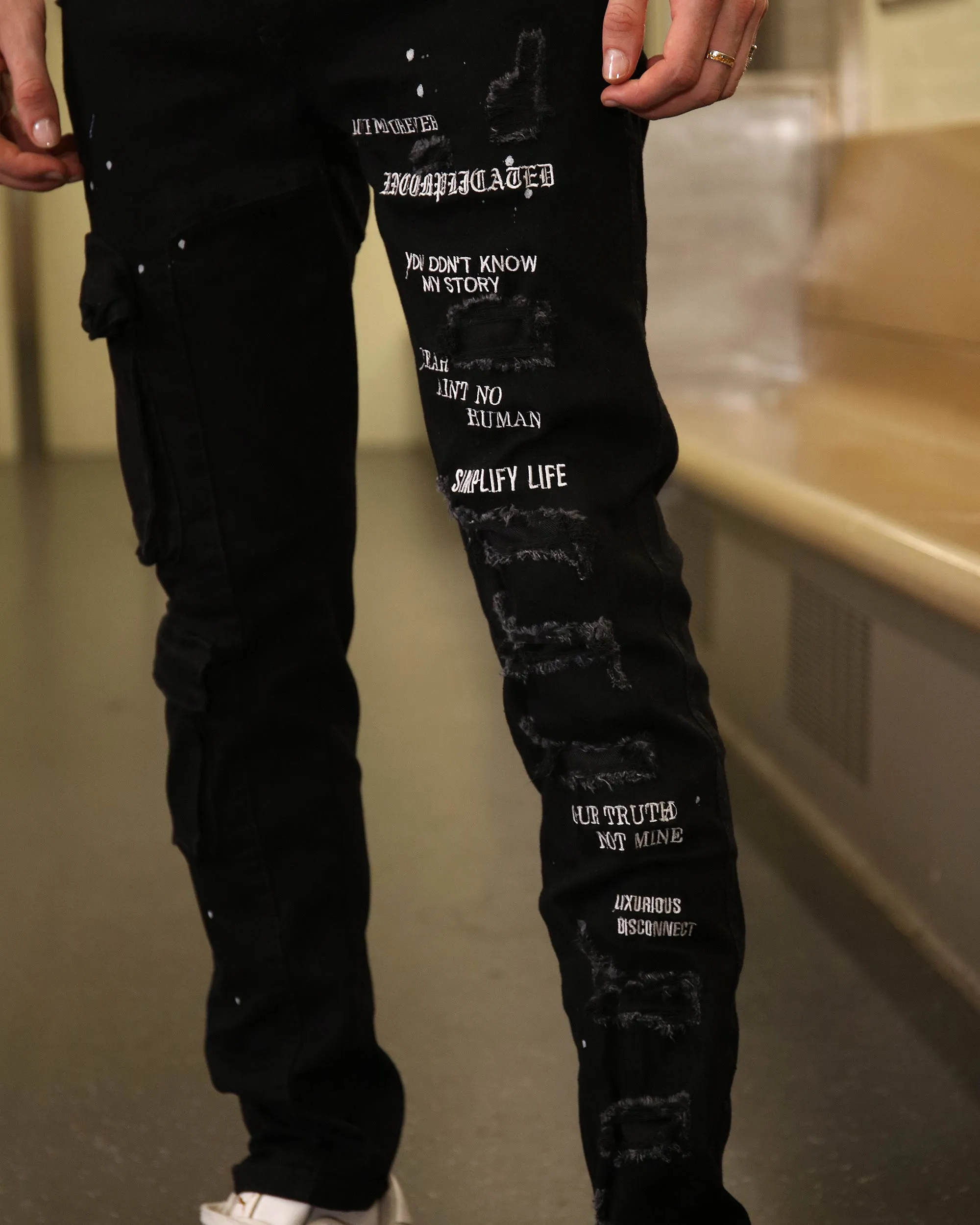 Straight Leg Black Ripped Jeans with Spray Paint Detailing