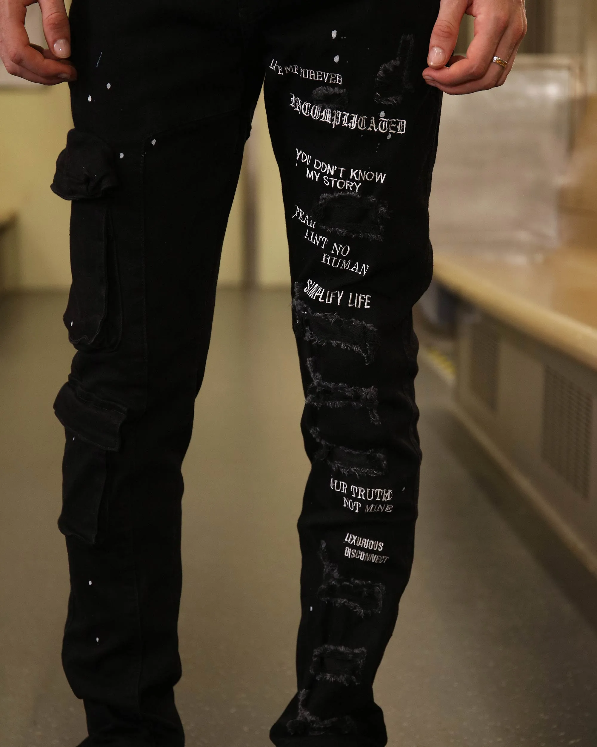 Straight Leg Black Ripped Jeans with Spray Paint Detailing